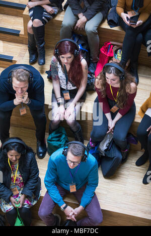 Overhead view audience listening with headphones Stock Photo