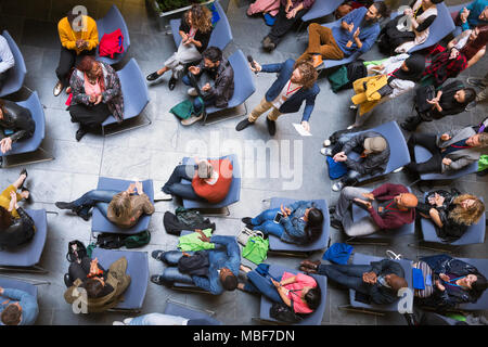Overhead view speaker and audience at conference Stock Photo