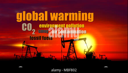 Global warming buzzwords with oil pumps silhouettes on clouds and sun in background. Keywords and pumpjack on oilfield on sunset. Concept of oil rig,  Stock Photo