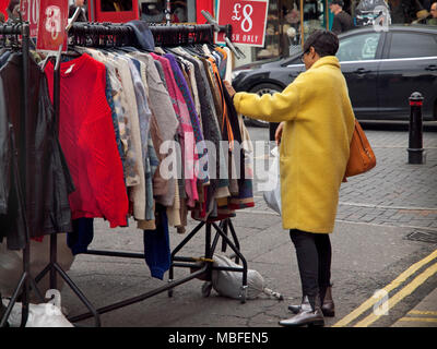 Shopping at a clothes stall in the North Laine area of Brighton Stock Photo