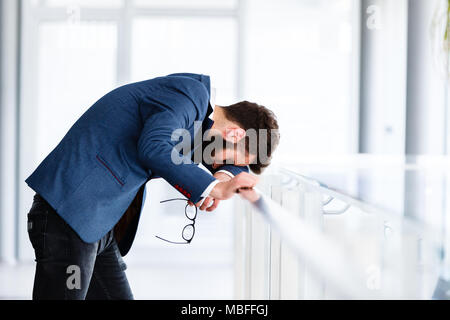 Depressed and sad man on hes job having problems Stock Photo