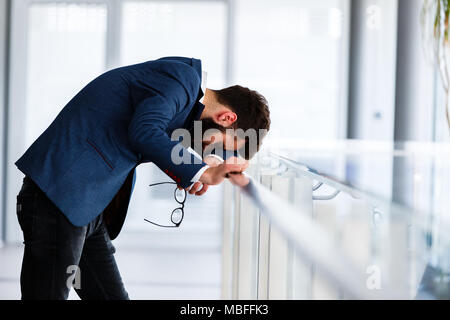 Depressed and sad man on hes job having problems Stock Photo