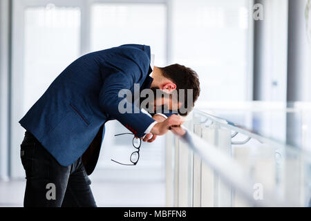 Depressed and sad man on hes job having problems Stock Photo