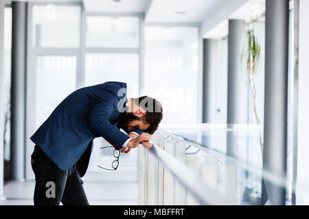 Depressed and sad man on hes job having problems Stock Photo
