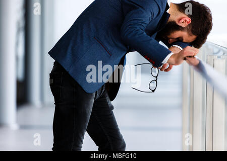 Depressed and sad man on hes job having problems Stock Photo