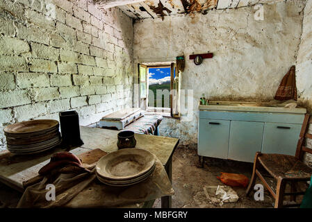 Abandoned house kitchen in the alpine village of Mindino, municipality of Garessio, in Piedmont, Italy. Stock Photo