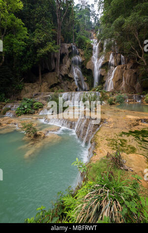 Side view of the beautiful main fall at the Tat Kuang Si Waterfalls near Luang Prabang in Laos. Stock Photo