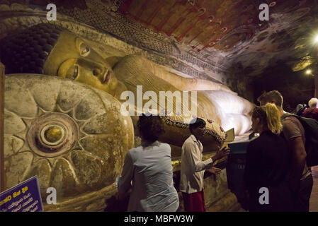 Horizontal view of the reclining Buddha statue in the Dambulla Cave Temple in Sri Lanka. Stock Photo