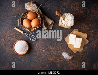 Ingredients for baking. Butter, eggs, sugar and flour  Stock Photo