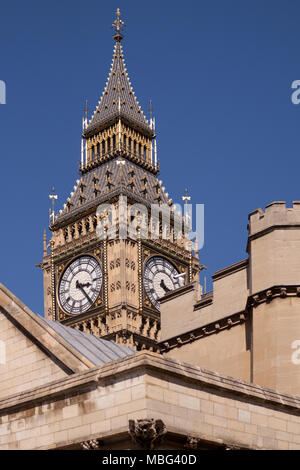 The Elizabeth (Clock) Tower at the Palace of Westminster, often known as Big Ben, glimpsed from St Margaret's Street to the southwest. London, UK Stock Photo