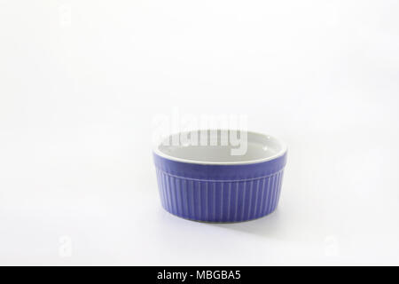 Porcelain souffle ramekin dish isolated on white background. Stock Photo