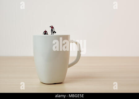Coffee divers. Conceptual macro photo. Stock Photo