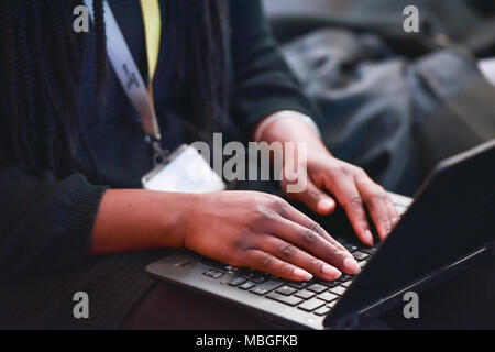 Close-up of hands on laptop Stock Photo