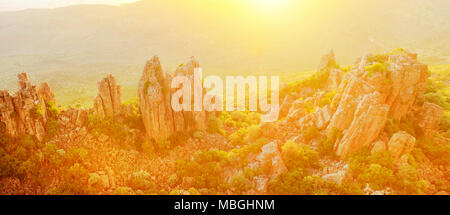 Panorama of Valley of Desolation also called The Cathedral of the Mountains, in Camdeboo National Park with sunset light. Karoo in Eastern Cape near Graaff-Reinet, South Africa. Banner with copy space Stock Photo