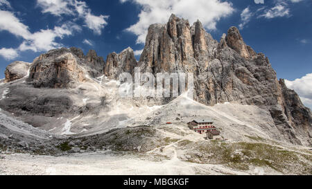 High rocky peaks of Pale di San Martino in Italian Dolomites with dramatic deep blue sky on sunny day. Stock Photo
