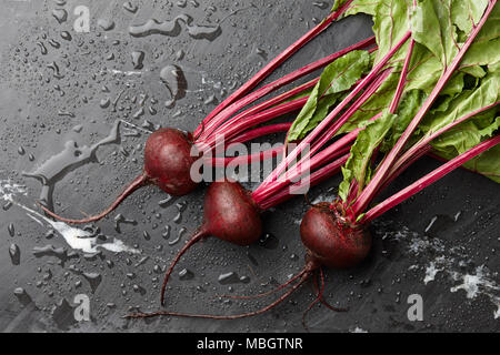 Fresh harvested beetroot on stone background, top view Stock Photo