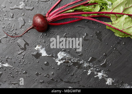 Fresh harvested beetroot on stone background, top view Stock Photo