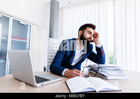 Businessman fell asleep on work desk Stock Photo