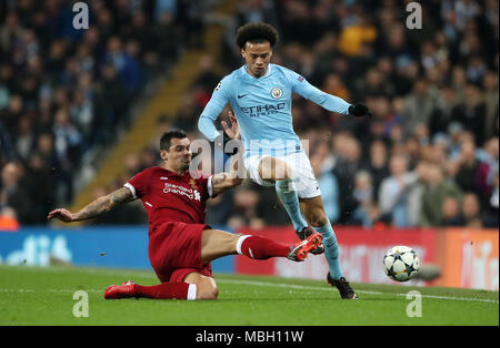 Liverpool's Dejan Lovren and Manchester City's Leroy Sane (right) battle for the ball during the UEFA Champions League, Quarter Final at the Etihad Stadium, Manchester. Stock Photo