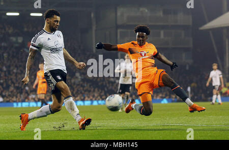 Fulham's Ryan Fredericks (left) and Reading's Omar Richards (right) battle for the ball during the Sky Bet Championship match at Craven Cottage, London. Stock Photo