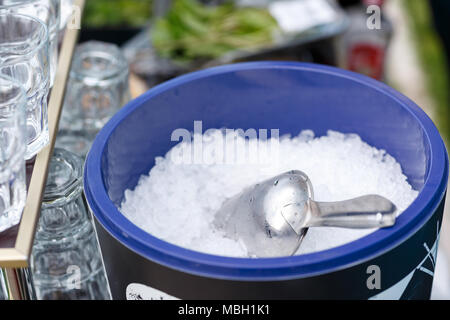 Ice Tube in Ice Bucket. Pieces of ice on a glass tray. The view from the top. Stock Photo