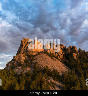 The faces of Washington, Jefferson, Roosevelt, and Lincoln at sunrise on Mount Rushmore in South Dakota. Stock Photo