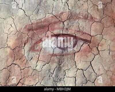 Textured and Painted Eye on Cracked earth Stock Photo