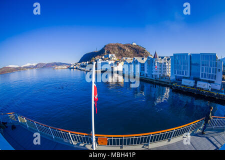 ALESUND, NORWAY - APRIL 06, 2018: Above view of Alesund port town on the west coast of Norway, at the entrance to the Geirangerfjord in a gorgeous blue sky Stock Photo