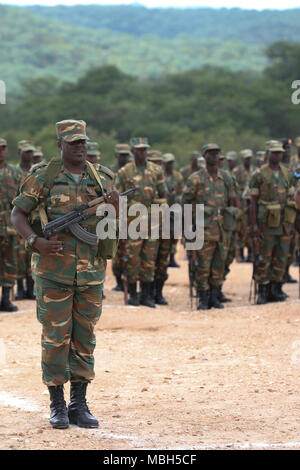 Zambian soldiers stand in formation during the closing ceremony of ZAMBAT IV at the Nanking Peace Mission Training Center, Lusaka, Zambia, March 29, 2018. Training modules included: marksmanship, mounted battle drills, training alongside Indian Army counterparts for battlefield trauma, cordon and search, and convoy operations with British soldiers. Zambian Infantry soldiers rehearsed tactics and real-world scenarios likely to be encountered while serving in support of the United Nations Multidimensional Stabilization mission in the Central African Republic (MINUSCA). Stock Photo