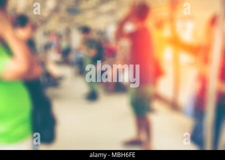 blurred of Commuters or passengers in a MRT train in Singapore Stock Photo