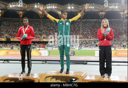 Gold medallist in the Women's 1500m Final South Africa's Caster Semenya (centre) alongside silver medallist Kenya's Beatrice Chepkoech (left) and Wales' Melissa Courtney at the Carrara Stadium during day seven of the 2018 Commonwealth Games in the Gold Coast, Australia. Stock Photo