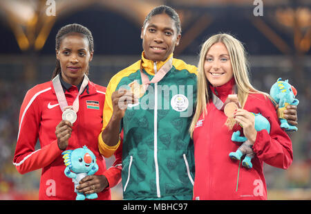 Gold medallist in the Women's 1500m Final South Africa's Caster Semenya (centre) alongside silver medallist Kenya's Beatrice Chepkoech (left) and bronze medallist Wales' Melissa Courtney at the Carrara Stadium during day seven of the 2018 Commonwealth Games in the Gold Coast, Australia. Stock Photo