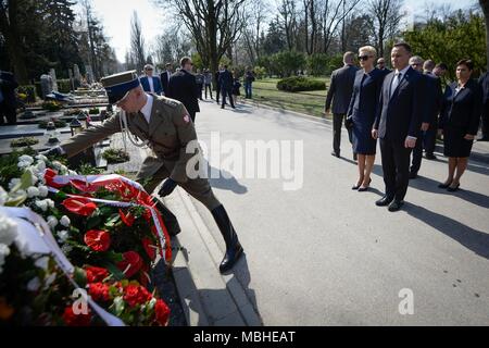 Warsaw, Poland. 10th Apr, 2018. Polish President Andrzej Duda attends the wreath laying ceremony for the victims of the plane crash in Smolensk of Russia at the Powazki Military Cemetery in Warsaw, Poland, on April 10, 2018. Poland marked on Tuesday the eighth anniversary of the plane crash in Smolensk of Russia in which 96 Polish people, including the then-Polish President Lech Kaczynski, were killed. Credit: Jaap Arriens/Xinhua/Alamy Live News Stock Photo