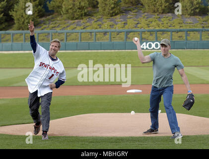 U.S. 10th Apr, 2018. SPORTS -- Albuquerque Mayor Tim Keller, left, and Albuquerque Police Department Det. Ryan Holets throw out the ceremonial first pitch during the Isotopes game with Las Vegas on Tuesday, April 10, 2018. Credit: Greg Sorber/Albuquerque Journal/ZUMA Wire/Alamy Live News Stock Photo
