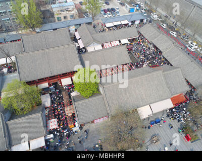 April 9, 2018 - Xi'An, Xi'an, China - Xi'an, CHINA-9th April 2018: Numerous tourists wait in a long line to experience 'drink wine and break the bowl' in Xi'an, northwest China's Shaanxi Province. Credit: SIPA Asia/ZUMA Wire/Alamy Live News Stock Photo