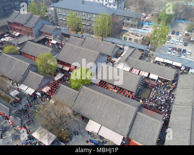 April 9, 2018 - Xi'An, Xi'an, China - Xi'an, CHINA-9th April 2018: Numerous tourists wait in a long line to experience 'drink wine and break the bowl' in Xi'an, northwest China's Shaanxi Province. Credit: SIPA Asia/ZUMA Wire/Alamy Live News Stock Photo