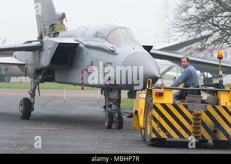 IWM Duxford, Cambridgeshire, UK. 11 April 2018. Imperial War Museums, working with RAF Marham, add Tornado GR4 ZA469 to the displays at IWM Duxford. Tornado GR4 ZA469 is transported from the Conservation Hall in AirSpace to the Battle of Britain exhibition, where it goes on display to visitors from 11 April 2018. The Tornado GR4 is the most significant combat jet used by the RAF during the last 27 years and continues in service until 2019. Credit: Malcolm Park/Alamy Live News. Stock Photo