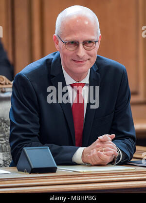 11 April 2018, Germany, Hamburg: Peter Tschentscher (SPD), mayor of Hamburg, sitting on the senate bench in the Hamburg Buergerschaft legislative assembly. Tschentscher gave his first government declaration. Photo: Axel Heimken/dpa Stock Photo