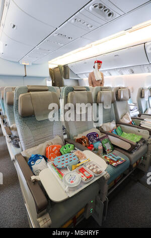 11 April 2018, Germany, Hamburg: An interior view of the Economy Class inside an Emirates' Boeing 777 during a press tour at Hamburg's airport. Emirates is presenting their newly designed interior spaces of the aircrafts. Photo: Christian Charisius/dpa Stock Photo