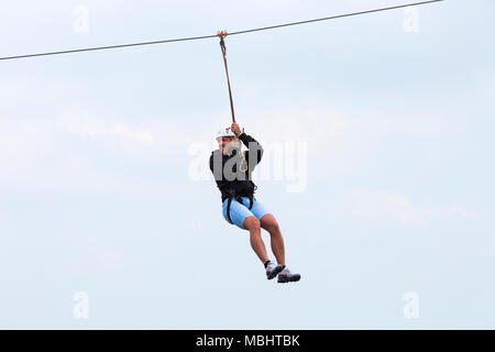 Bournemouth, Dorset, UK. 11th Apr, 2018. Celebrities take on Bournemouth zipline zipwire zip line zip wire ziplining from Bournemouth Pier to the beach. Pier to shore challenge ziplining from the pier to the beach below. Jason Burrill Credit: Carolyn Jenkins/Alamy Live News Stock Photo