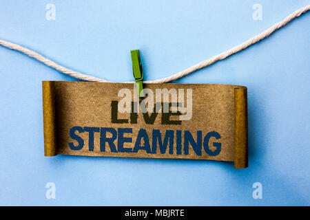 Handwriting text Live Streaming. Concept meaning Media real-time transmission Multimedia Technology Broadcast written Cardboard Paper hanging on rope  Stock Photo