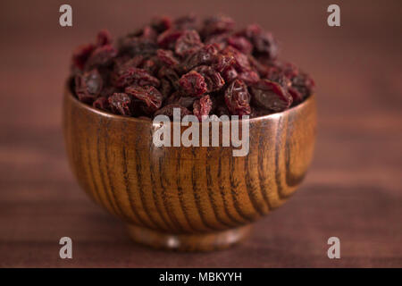 Dried Cranberries in a Wooden Bowl Stock Photo