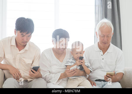 Asian family gadgets Stock Photos, Royalty Free Asian family gadgets Images