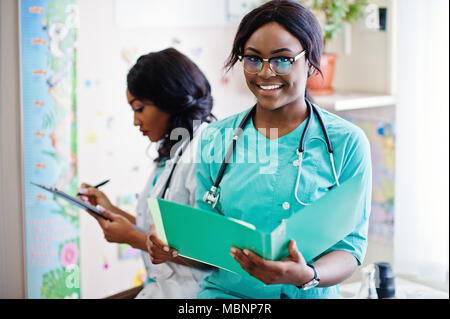 Two african american pharmacist working in drugstore at hospital pharmacy. African healthcare. Stock Photo