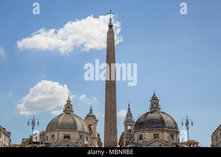 The Flaminio Obelisk in Piazza del Popolo, Rome, Italy, seen here with the domes of the twin churches Santa Maria in Montesanto and Santa Maria dei Mi Stock Photo