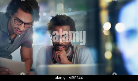 Businessmen using digital tablet and laptop Stock Photo