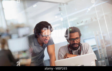 Creative businessmen using laptop in office Stock Photo