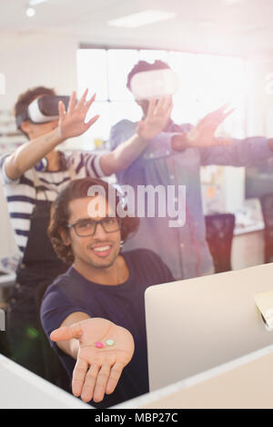 Portrait computer programmers testing virtual reality simulators Stock Photo