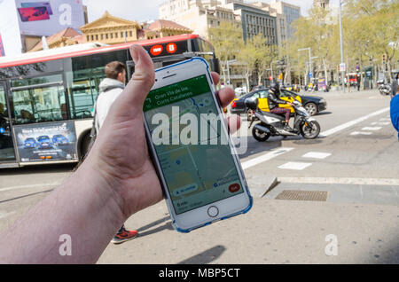 Navigating Barcelona using Google Maps on an iPhone to navigate around the city. Stock Photo