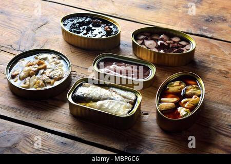 tin cans on a table Stock Photo